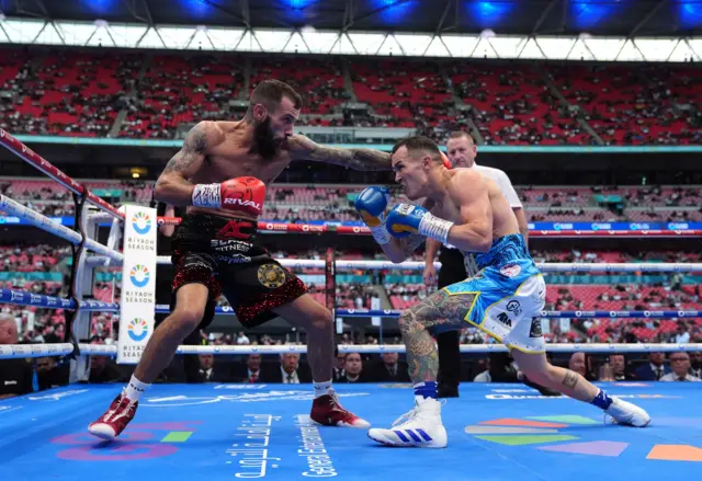 Anthony Cacace tries to punch Josh Warrington