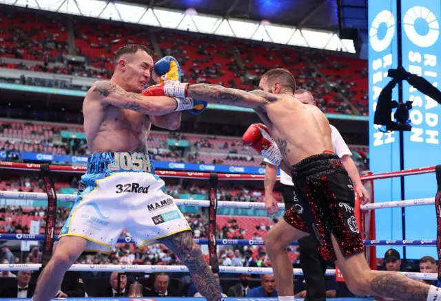 Josh Warrington is punched on the nose by Anthony Cacace