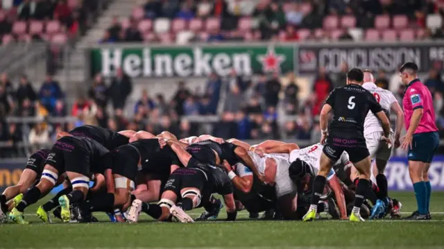 The teams lock in a scrum during tonight's URC opener in Belfast