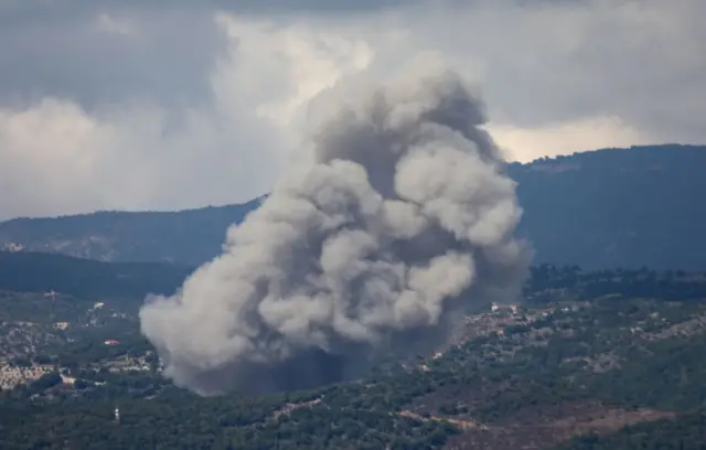 Reuters news agency has released images appearing to show smoke rising above Jabal Al Rihan in southern Lebanon - near the border with Israel