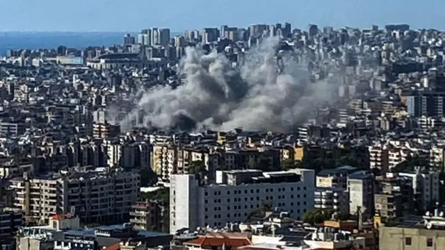 Thick smoke rises above the southern suburbs of Beirut after an Israel strike on September 20