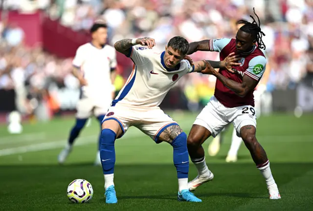 Enzo Fernandez of Chelsea is challenged by Aaron Wan-Bissaka