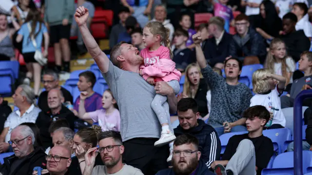 Bolton fans celebrate their win over Reading.