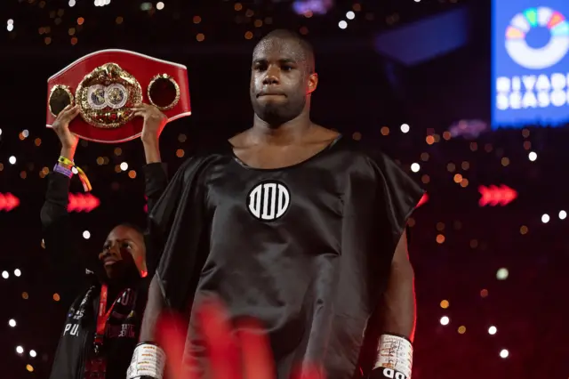 Daniel Dubois wearing a black cape