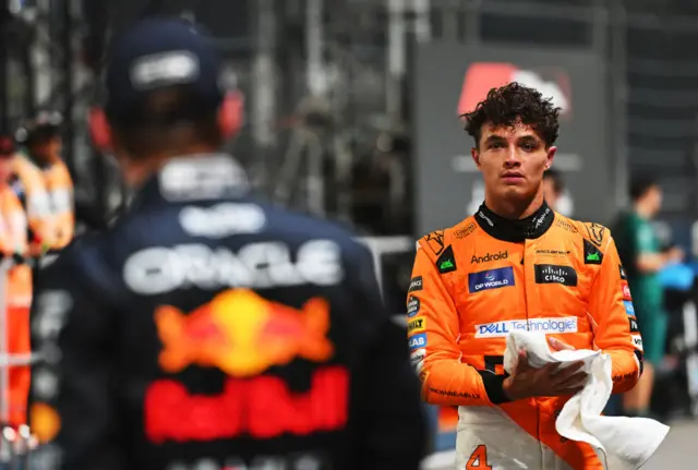 Lando Norris looks over at max Verstappen