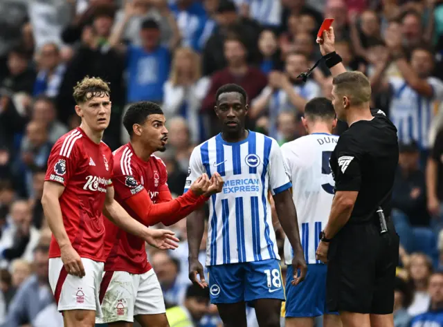 Gibbs-White reacts in horror to his red card