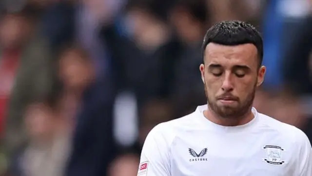 Preston's Sam Greenwood walks from the pitch following his red card v Blackburn