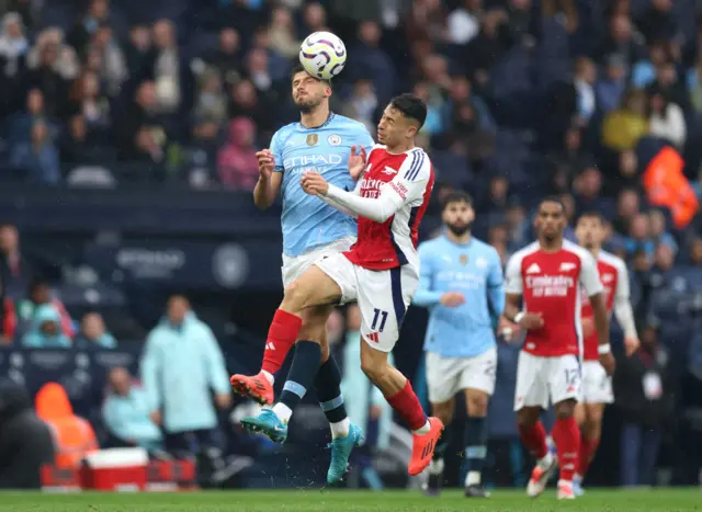 Diaz and Martinelli battle for the ball