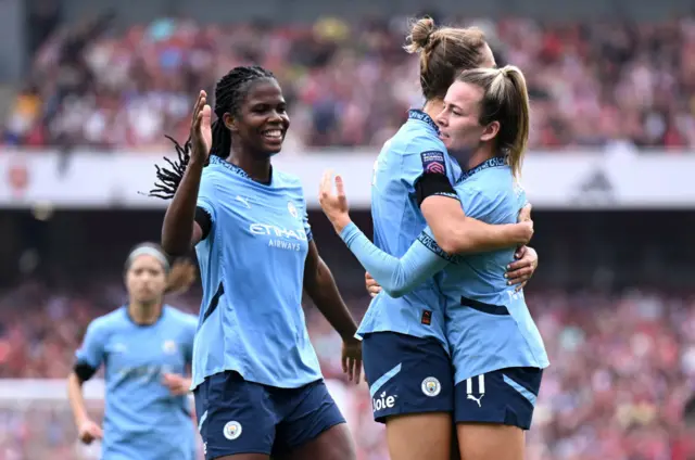 Miedema is mobbed by teammates after equalising