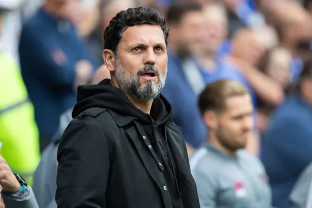 Erol Bulut looking on in the dugout