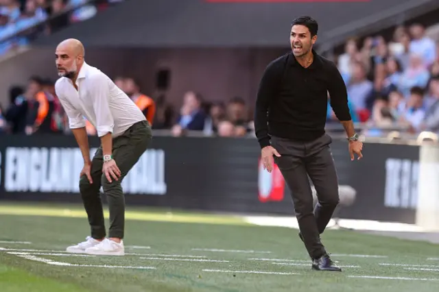 Head Coaches Pep Guardiola of Manchester City with Mikel Arteta