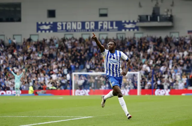 Welbeck celebrates with a finger in the air