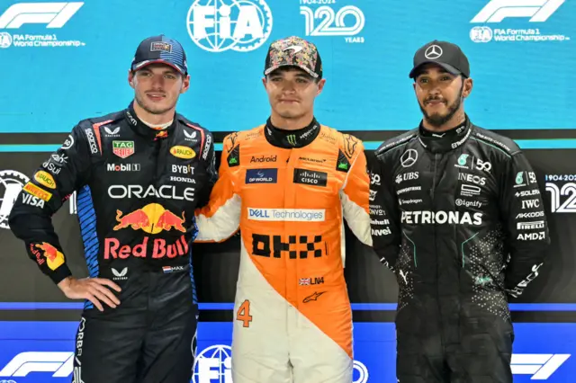 Max Verstappen, Lando Norris and Lewis Hamilton pose for pictures after qualifying