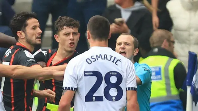 Owen Beck (centre) alleged Preston's Milutin Osmajic bit him in the aftermath of the Blackburn man's red card