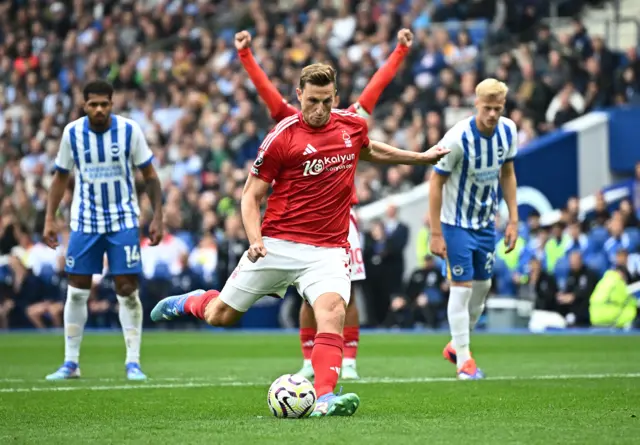 Chris Wood scores his penalty with maximum focus