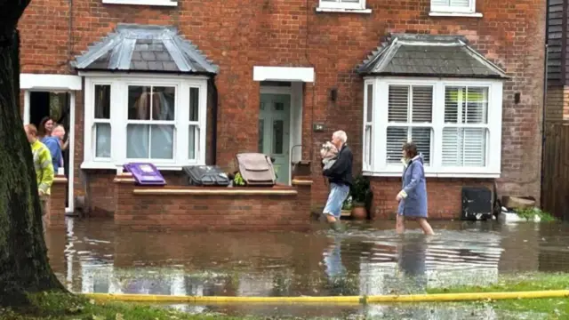 Homes are flooded on Woolgrove Road along the River Purwell in Hitchin