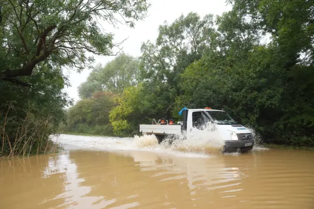 A van driving in flood water on Hardwater Road near Wellingborough