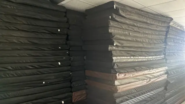 Mattresses in school classroom in Lebanon