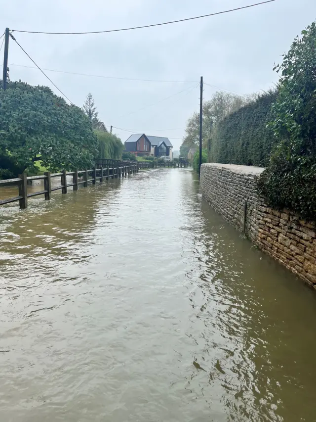 A flooded path in Yardley Hastings, Northamptonshire.