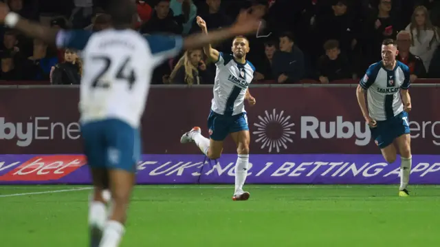 Hallam Hope celebrates his equaliser against Fleetwood.