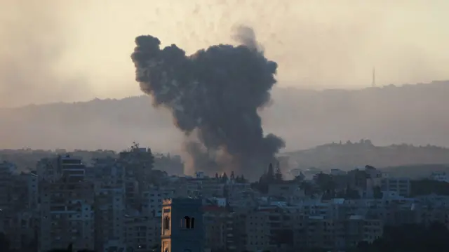 Smoke billows over southern Lebanon following Israeli strikes, amid ongoing cross-border hostilities between Hezbollah and Israeli forces, as seen from Tyre, southern Lebanon