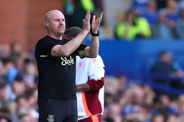 Sean Dyche the head coach applauds on the touchline