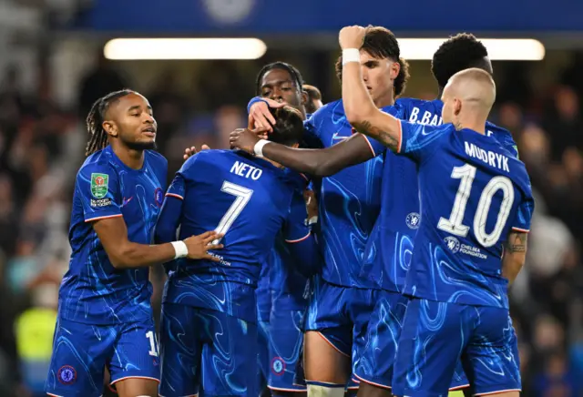 Pedro Neto is surrounded by his team-mates after scoring for Chelsea against Barrow in the EFL Cup