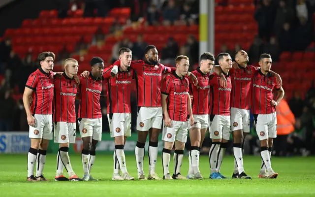 Walsall players line up during the penalty shootout against Leicester City in the EFL Cup