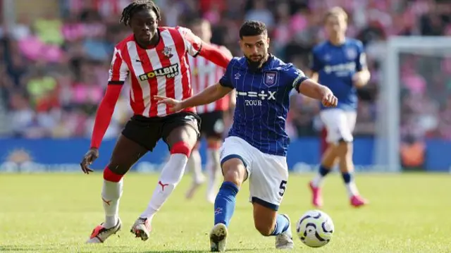 Sam Morsy of Ipswich Town is challenged by Lesley Ugochukwu