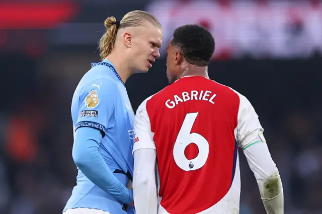 Gabriel Magalhaes of Arsenal and Erling Haaland of Manchester City square up to each other