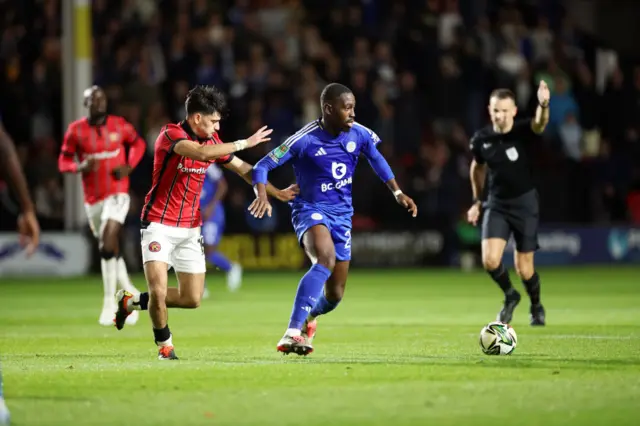 Ronan Maher closes down Boubakary Soumare during Walsall's EFL Cup tie at home to Leicester City