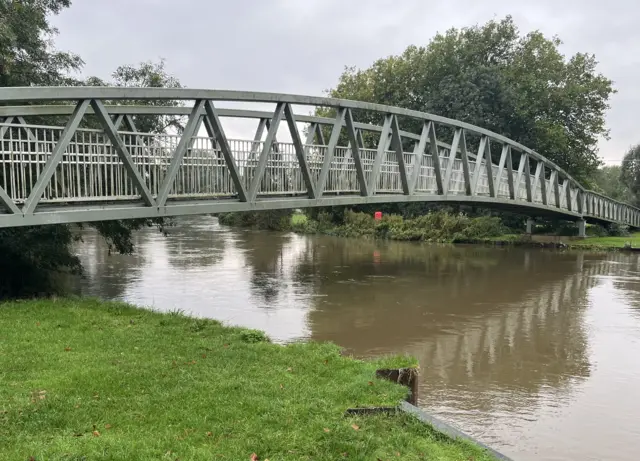 The Great River Ouse in Eynesbury in St Neots is pictured. The water levels are high and a bridge is pictured over the river.