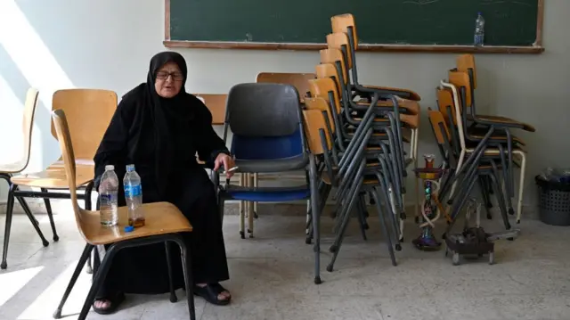 Woman in school shelter