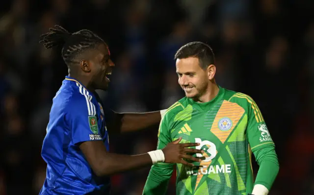 Danny Ward is congratulated by Caleb Okoli after Leicester City's penalty-shootout win at Walsall in the EFL Cup