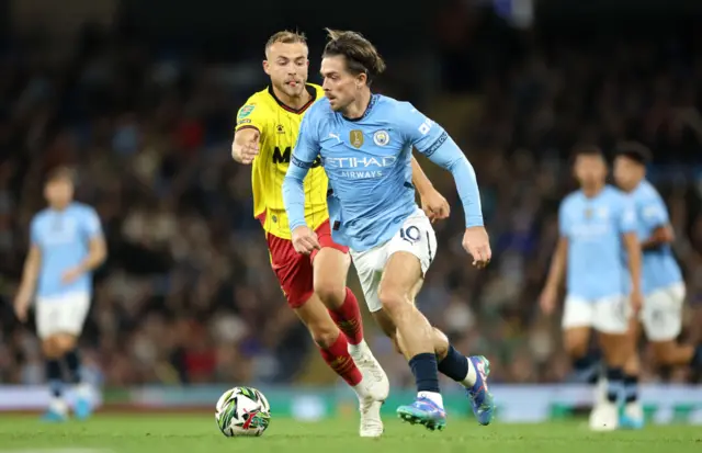 Jack Grealish is closed down by Ryan Porteous during Manchester City's EFL Cup tie at home to Watford