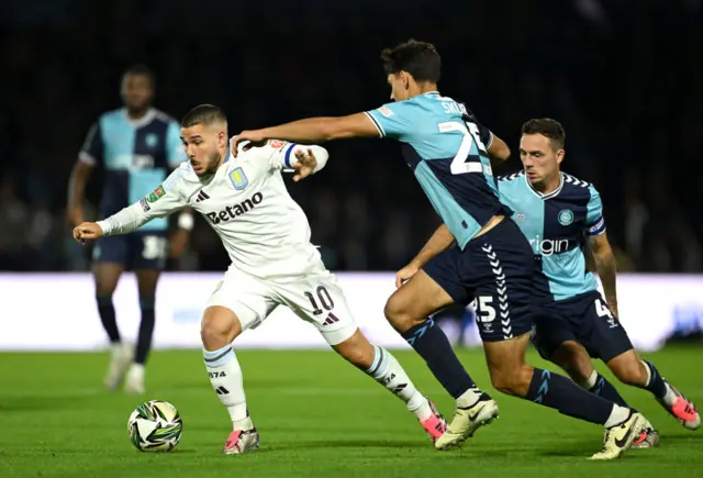 Emi Buendia is closed down by Declan Skura during Wycombe Wanderers' EFL Cup tie at home to Aston Villa