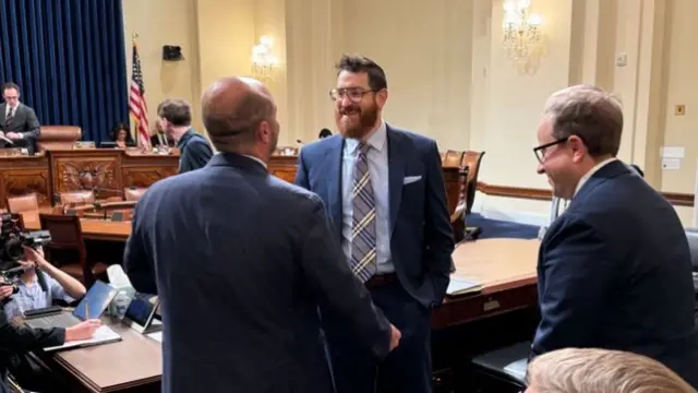 Adam Meyers (centre) arrives at the hearing