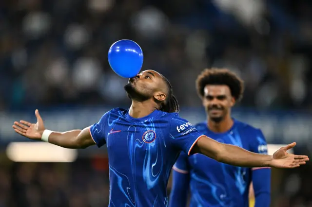 Christopher Nkunku celebrates scoring for Chelsea in the EFL Cup against Barrow