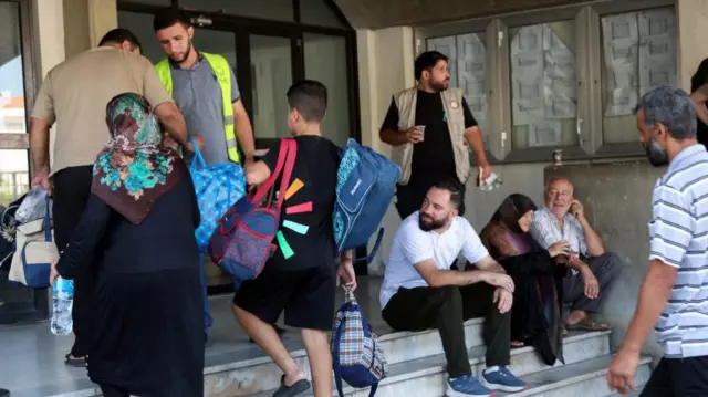 Internally displaced people, who fled from their southern Lebanon villages due to ongoing cross-border hostilities between Hezbollah and Israeli forces, arrive to take shelter at the Technical Institute of Bir Hassan, in Beirut Lebanon September 24, 2024. R