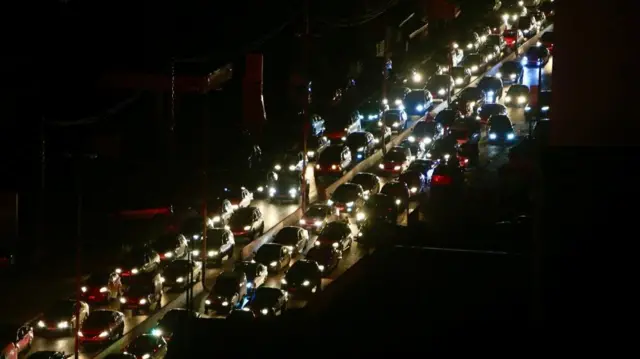 A road near the town of Ghazieh is seen gridlocked as people make their way towards the cities of Sidon and Beirut