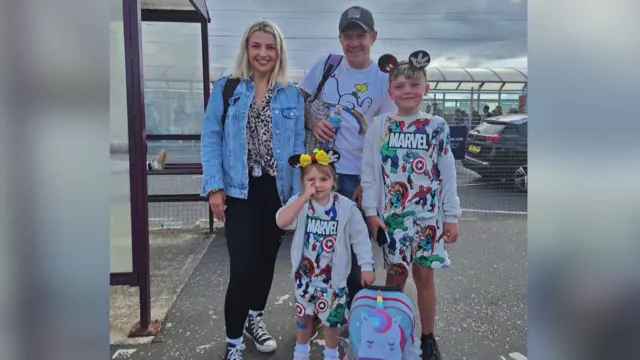 Jo showed me this picture of her kids, beaming in Mickey Mouse ear headbands and Marvel outfits on the way to the airport on 19 July