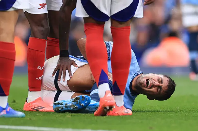 Rodri lays on the pitch injured