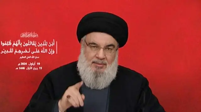 A file photo of Hezbollah leader Hassan Nasrallah speaking to camera during a TV address