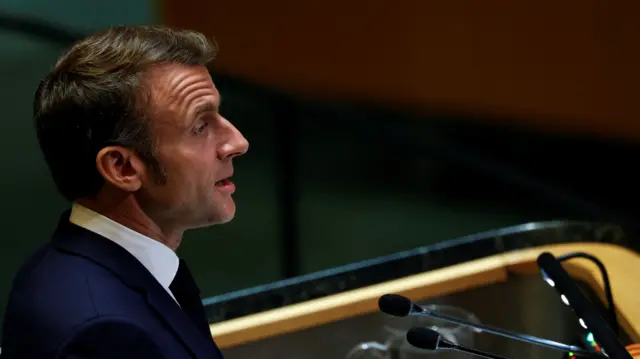 Macron addressing the UN from a podium as seen from the side