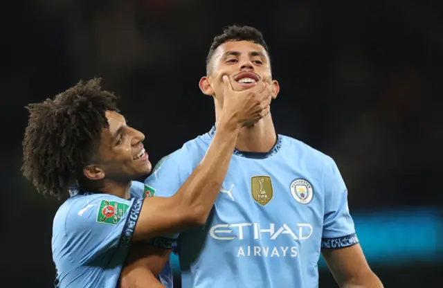 Matheus Nunes of Manchester City (right) celebrates with teammate Rico Lewis