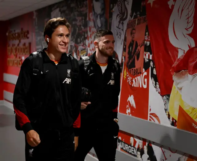 Chiesa walks through the stadium with Robertson