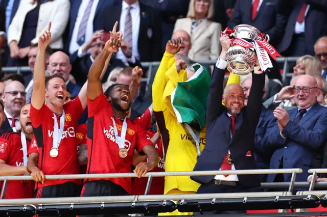 Erik ten Hag holding the FA Cup