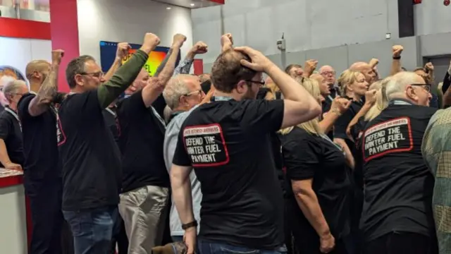 Campaigners at the Labour Party conference in Liverpool wear shirts that say: defend the winter fuel payment