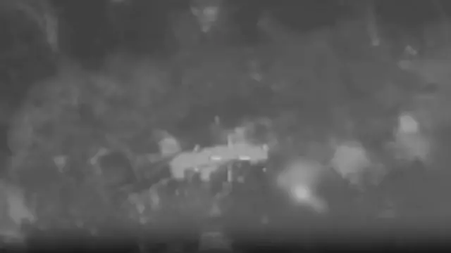 Black and white aerial video screenshot of Israeli Air Force strike on projectile launcher in Lebanon