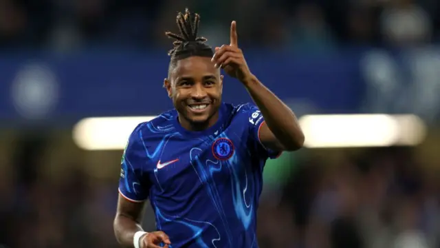 Christopher Nkunku of Chelsea celebrates scoring his team's fifth goal, and completing his hattrick during the Carabao Cup Third Round match between Chelsea and Barrow at Stamford Bridge on September 24, 2024 in London, England.